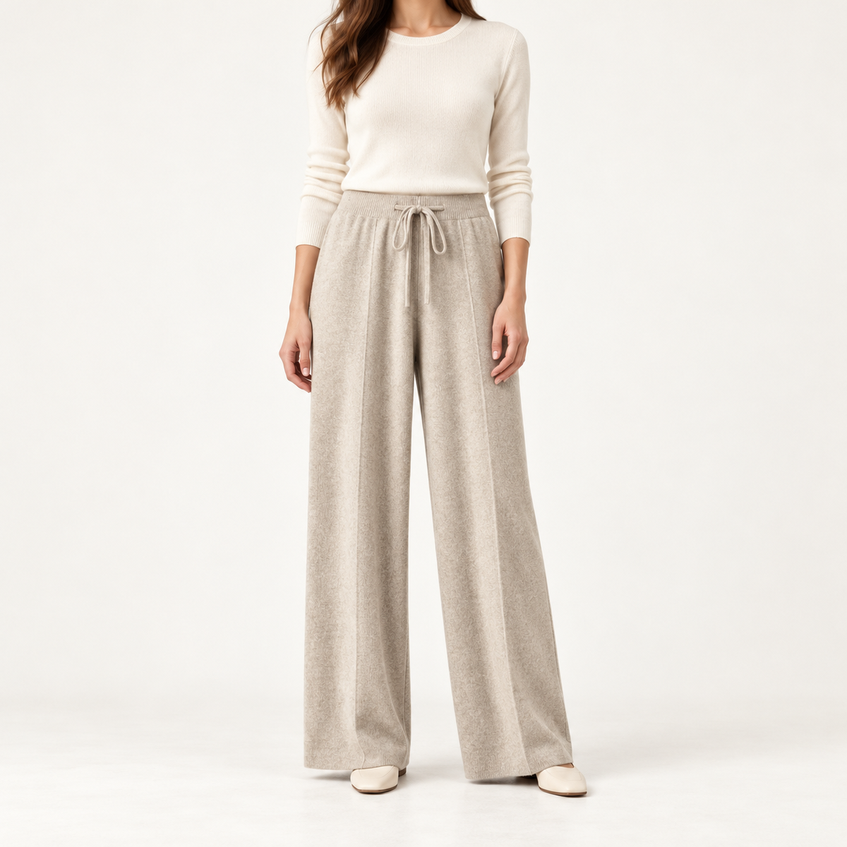 Beige knit wide-leg drawstring trousers, front view on a model