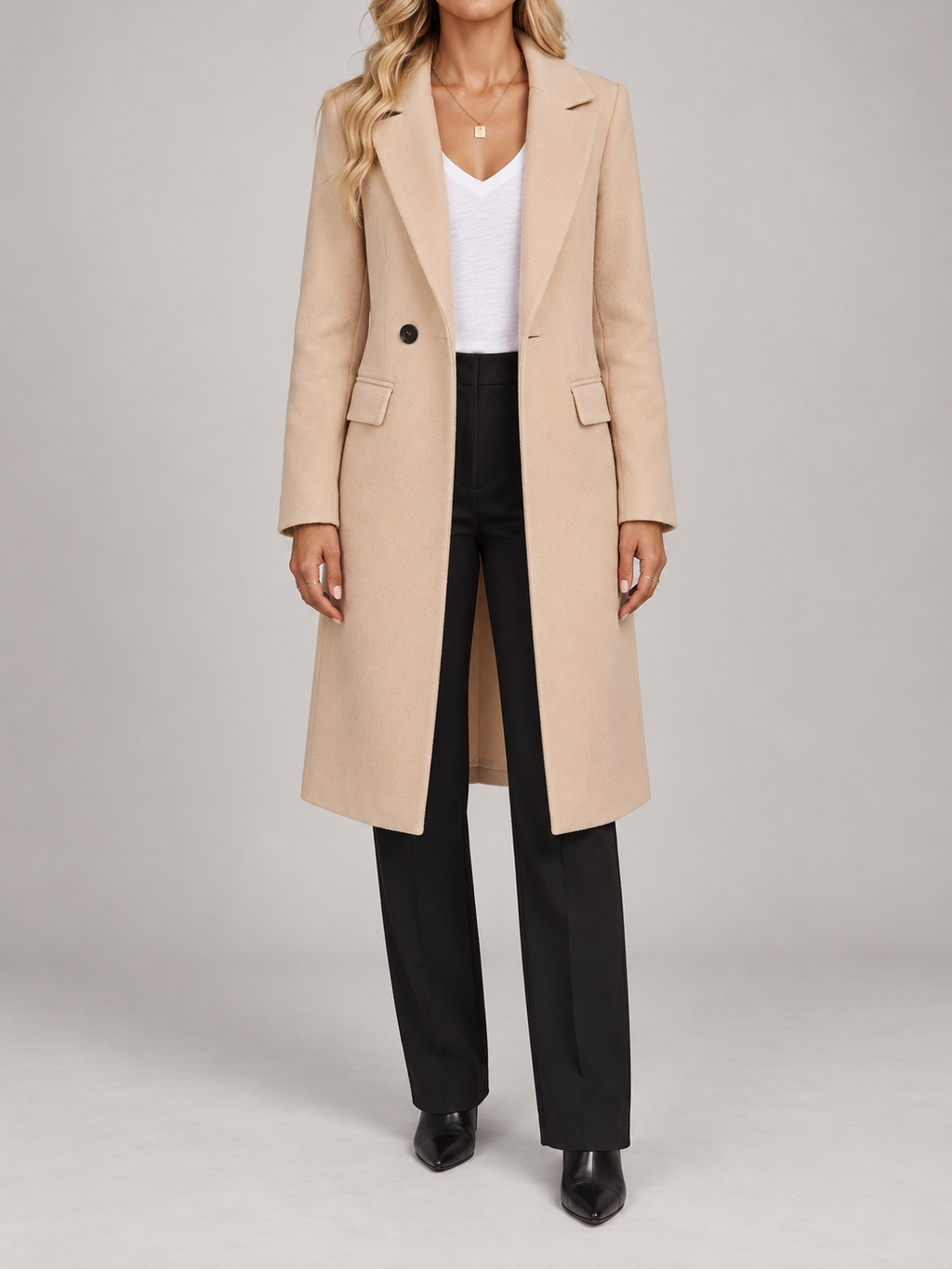 apricot knee-length single-breasted straight lapel coat with flap pockets, front view on a model
