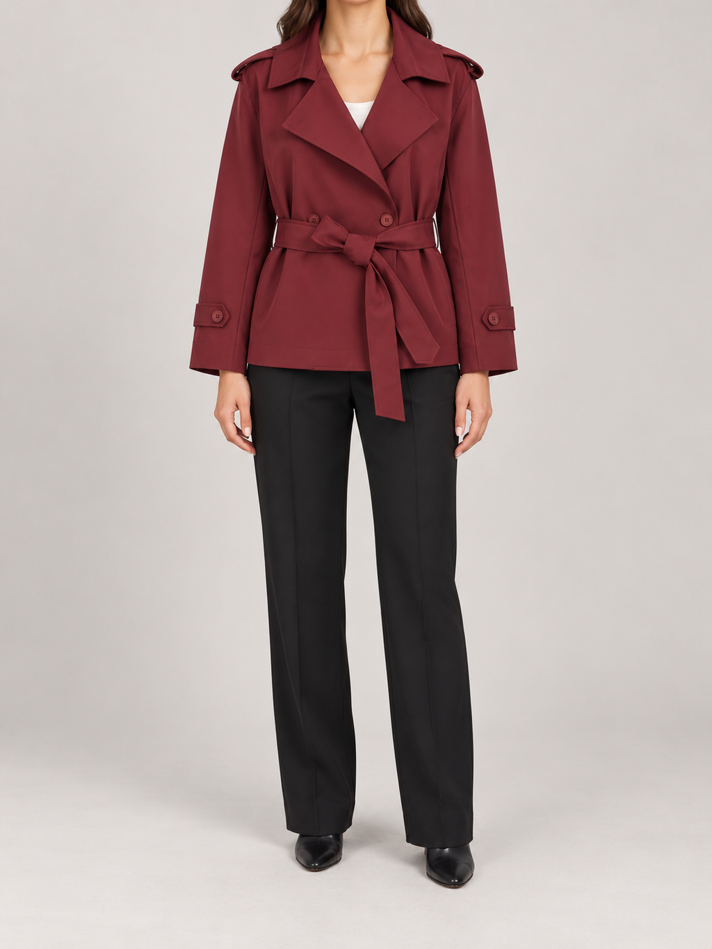 burgundy short double-breasted trench, wide lapels, shoulder tabs, waist tie, cuff tabs, front view on a model