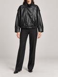 black cropped leather-look bomber with tall stand collar, asymmetric snap front, dropped shoulders and elasticated hem, front view on a model