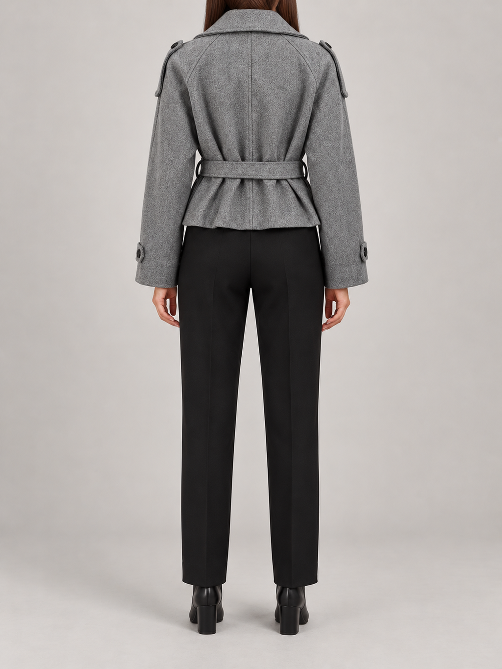 Grey cropped belted jacket on a model, back view