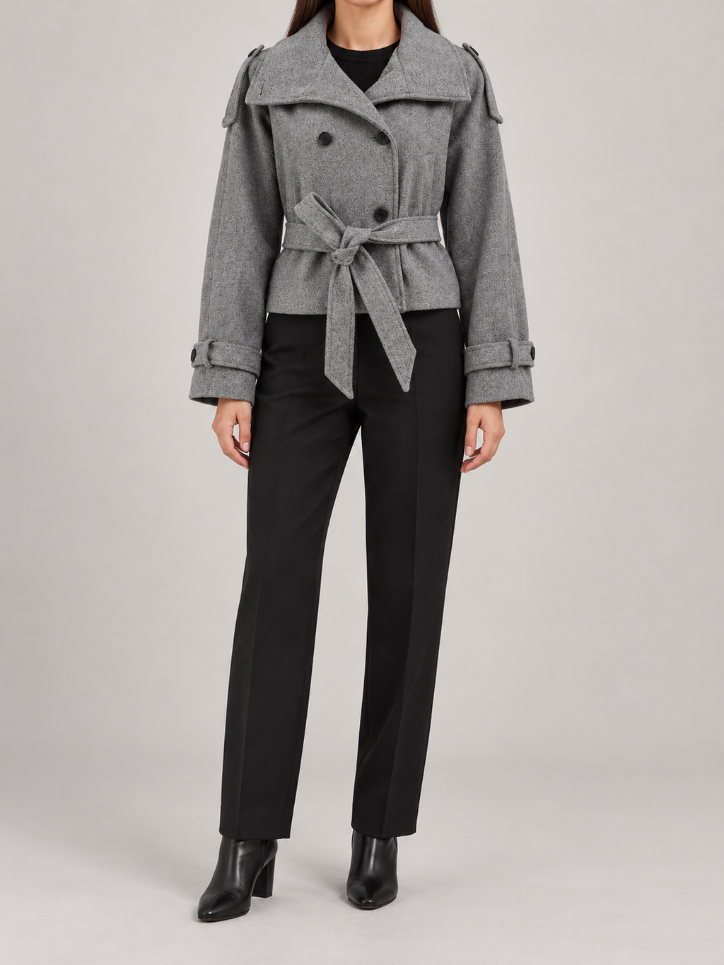 Grey cropped belted jacket on a model, front view