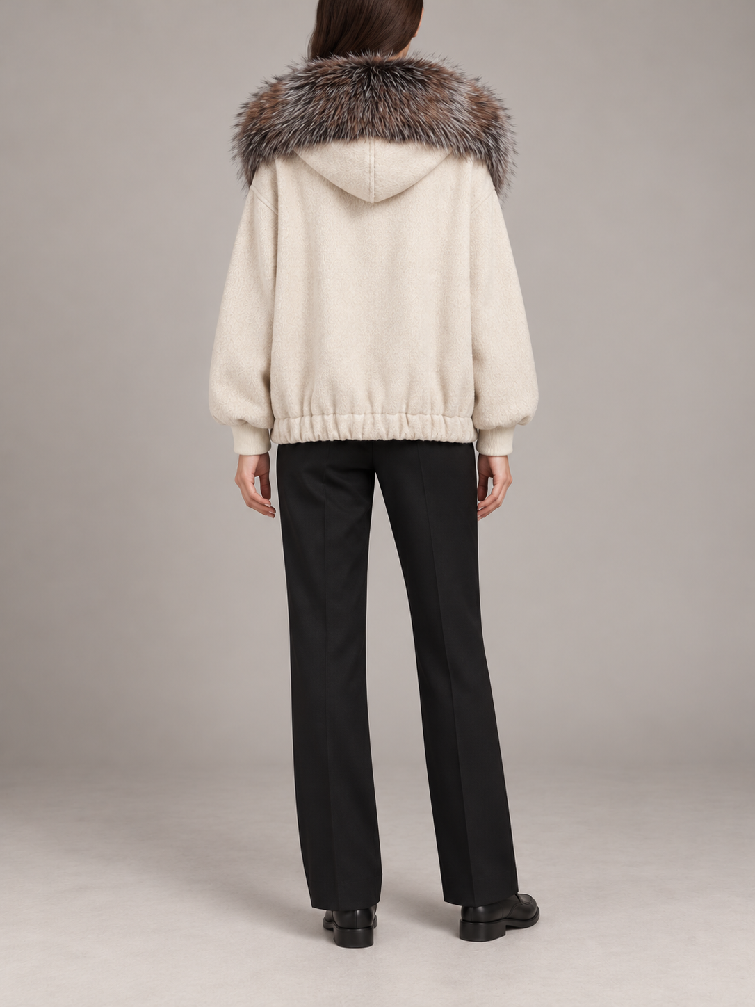 ivory relaxed hooded jacket with multitone brown-grey faux-fur collar trim, gathered hem and patch pockets, back view on a model