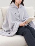 light grey plush zip-front heated throw worn over shoulders, front view