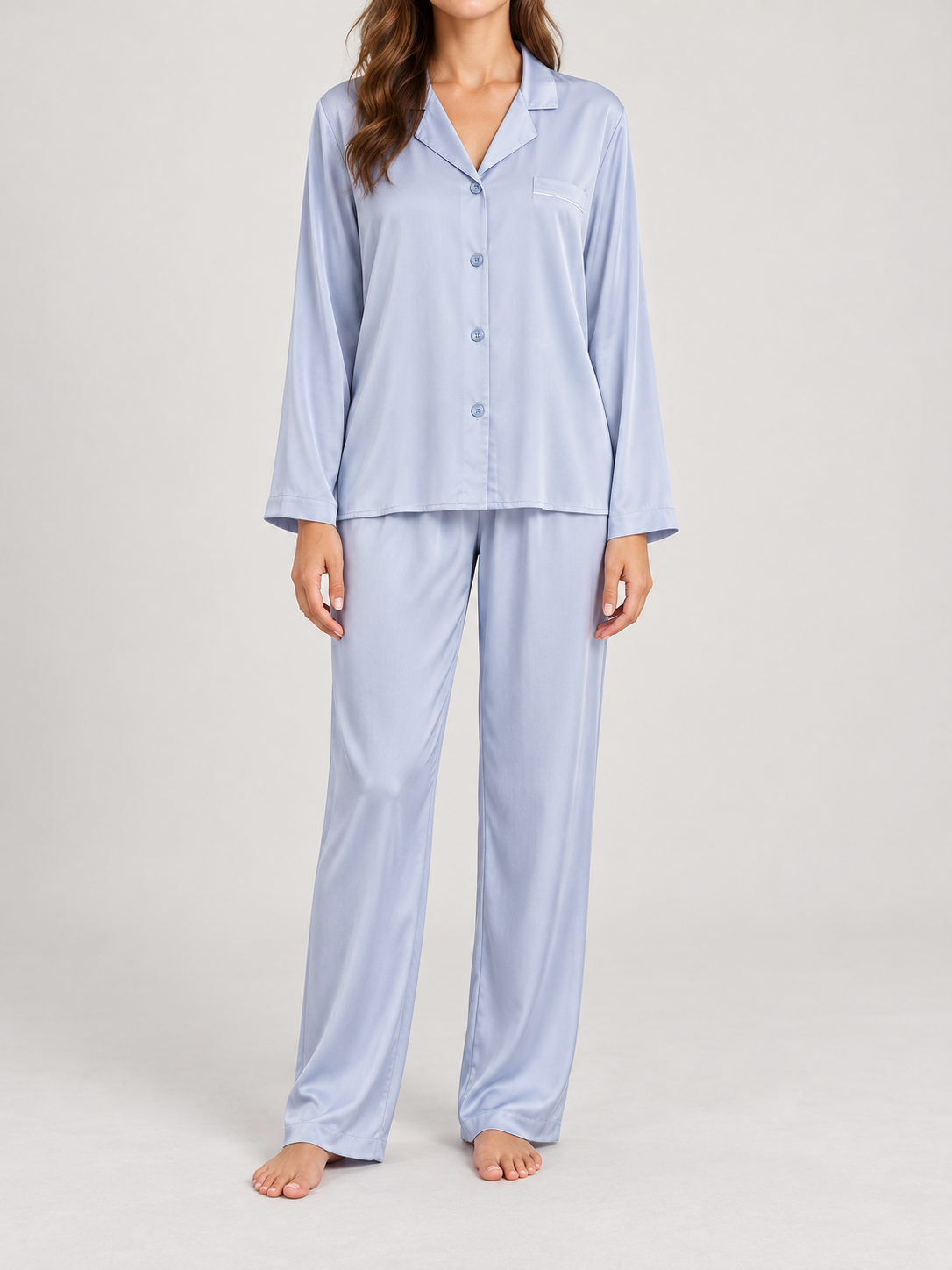 light blue satin long-sleeved button pajama top and matching trousers, front view