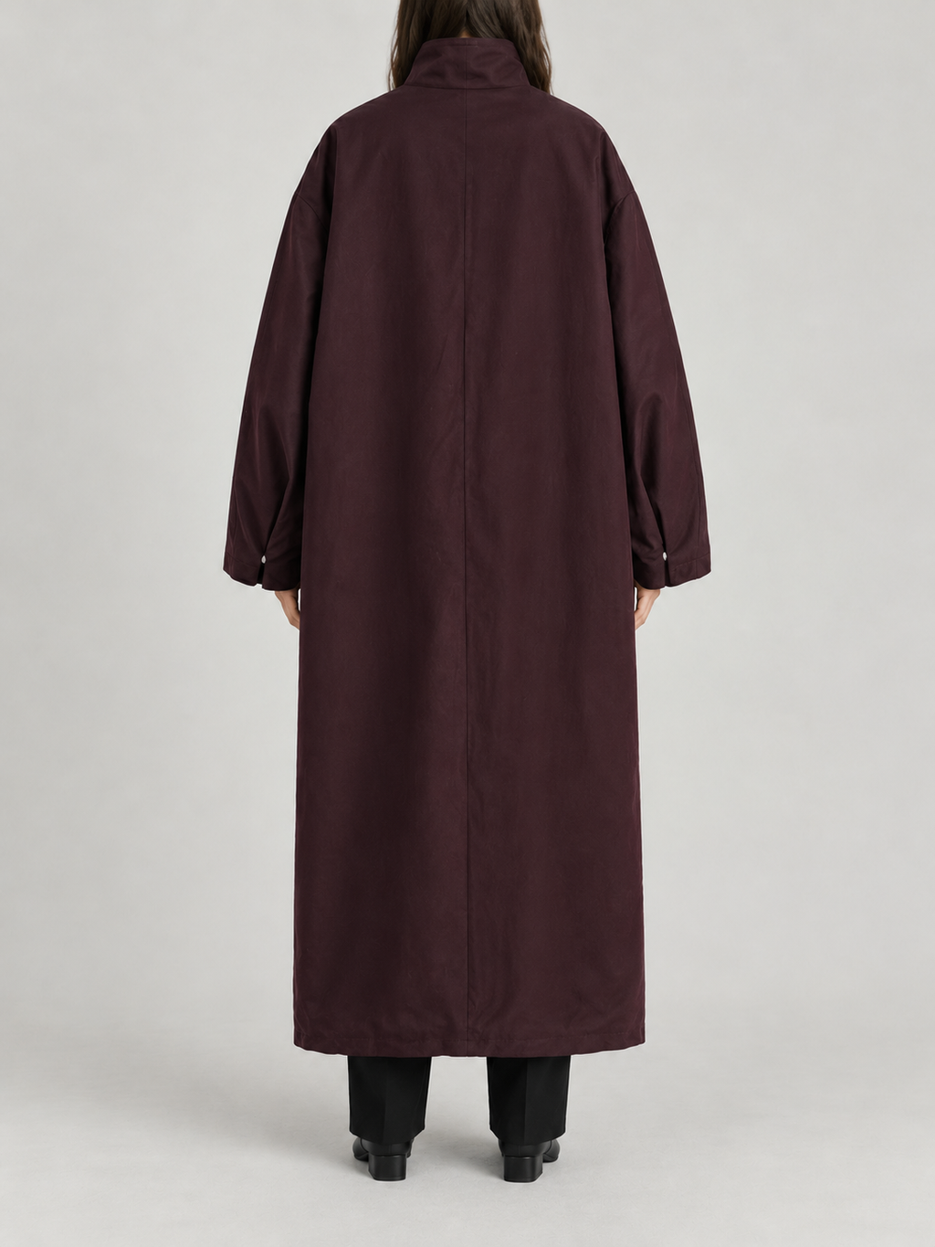 dark plum oversized ankle-length high-neck trench, concealed placket and very wide dropped shoulder sleeves, back view on a model