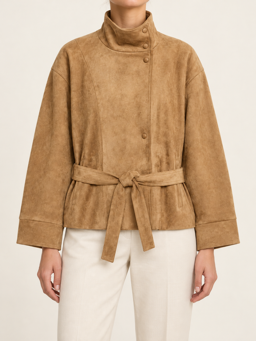 Camel tie-waist jacket with stand collar, front view on model